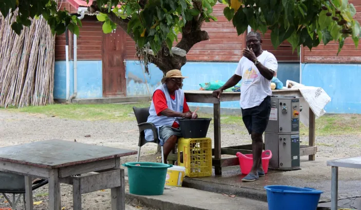 Woman cleaning fish